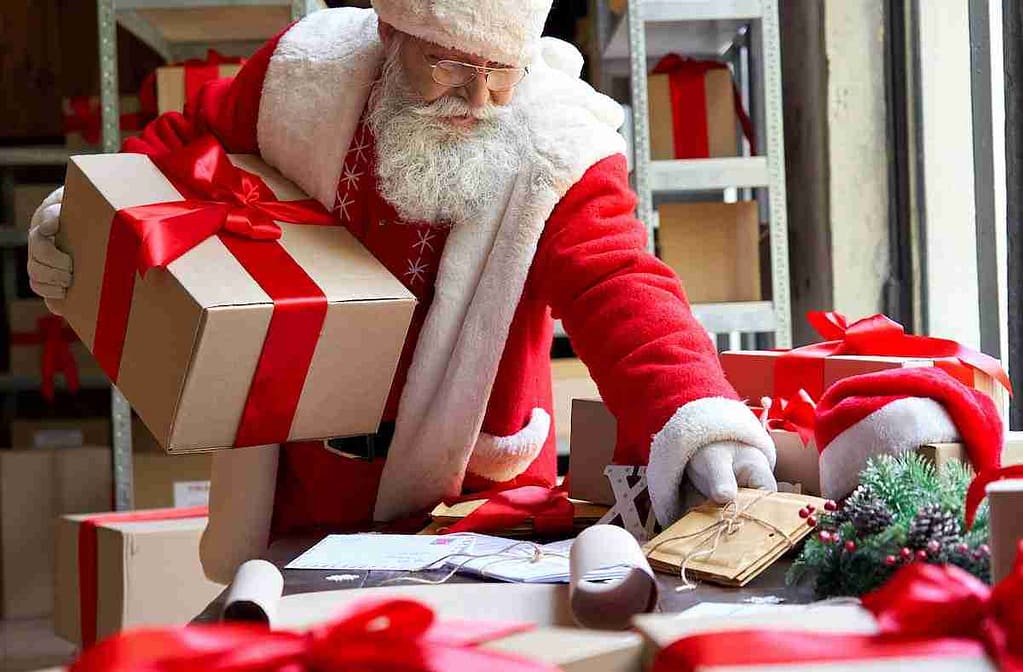 Santa wrapping gifts