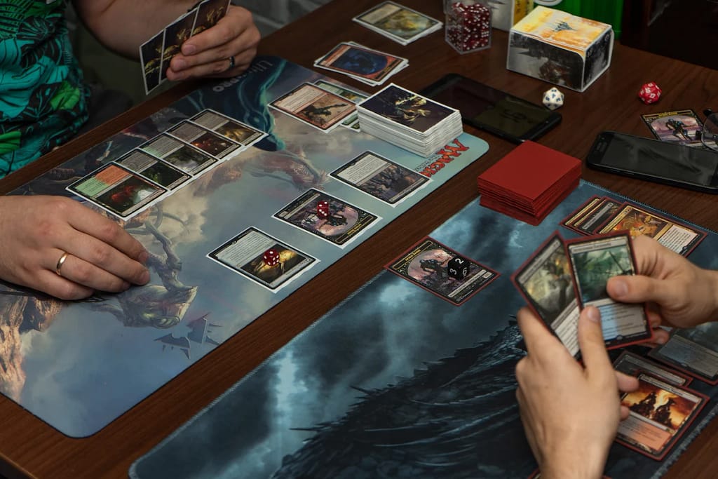 2 people playing Magic: the Gathering on playmats